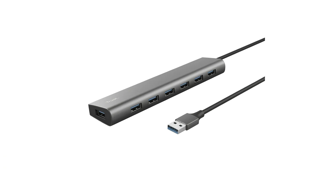 Sivý hliníkový USB rozbočovač Trust Halyx 7 ports so siedmimi portami USB-A a pripojeným čiernym káblom.