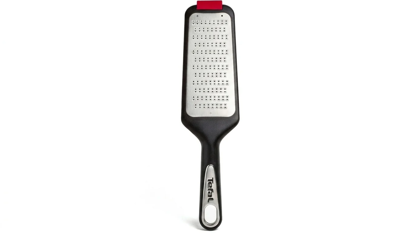 Ruční struhadlo Tefal Ingenio s nerezovou strouhací plochou, černou rukojetí a červeným protiskluzovým zakončením.