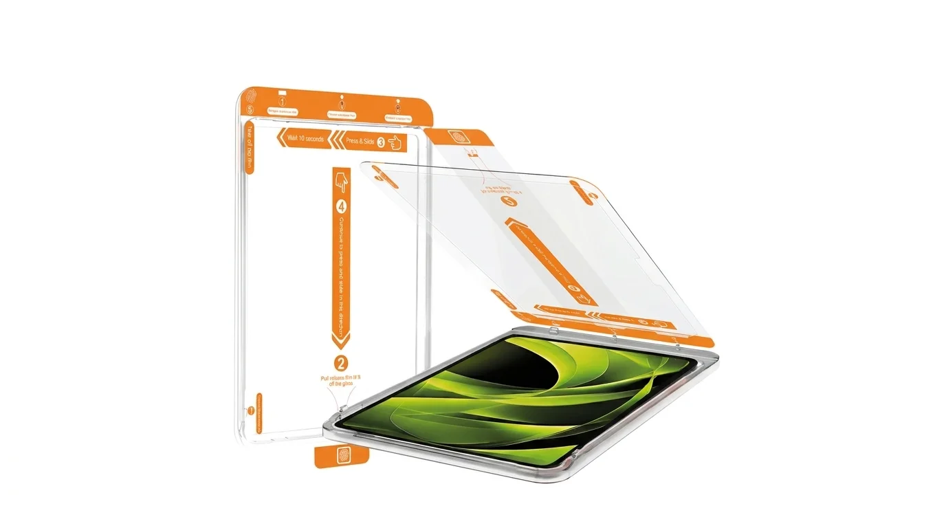 Aplikace ochranného skla Mobile Origin na iPad pomocí instalačního rámečku s oranžovými vodicími prvky.
