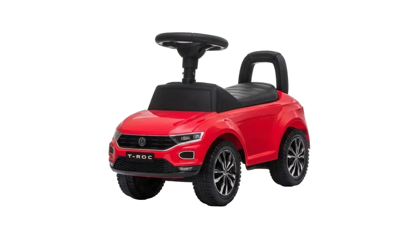 Červené detské odrážadlo Buddy Toys VW T-ROC s volantom a čiernym sedadlom s opierkou.
