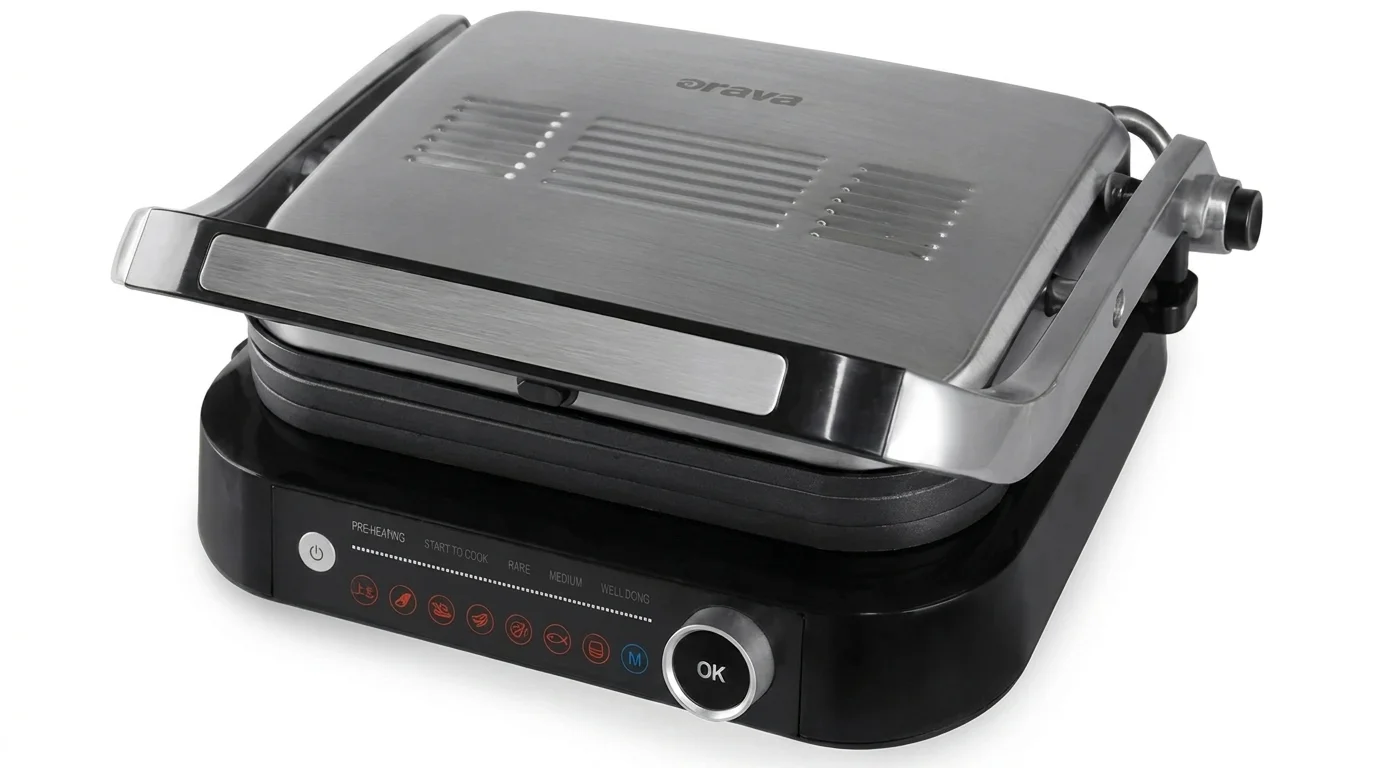 Stolní gril Orava Grillchef-2 v nerezovém provedení s černou základnou a digitálním ovládacím panelem.