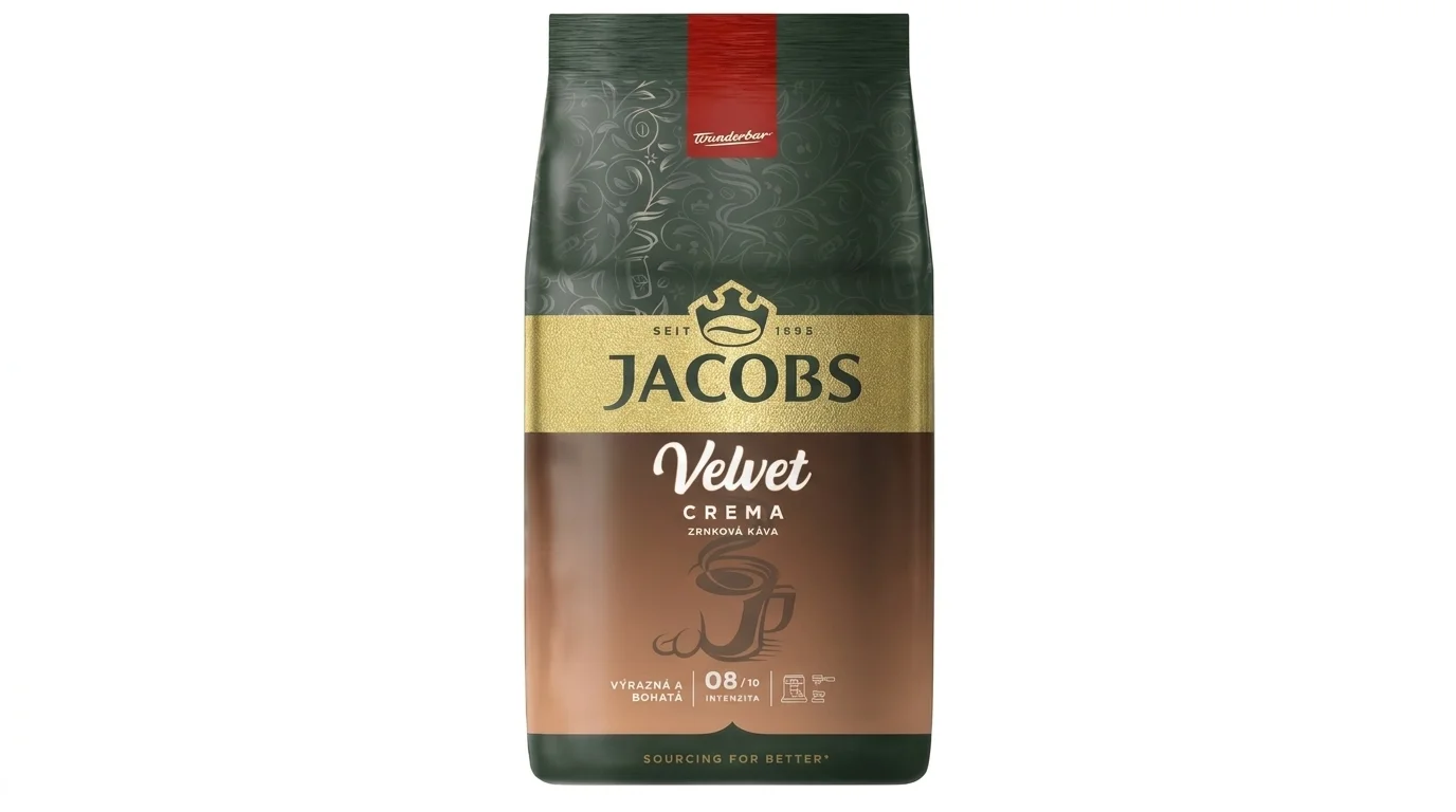 Balenie zrnkovej kávy Jacobs Velvet Crema v zeleno-hnedom obale so zlatým pruhom a logom značky.