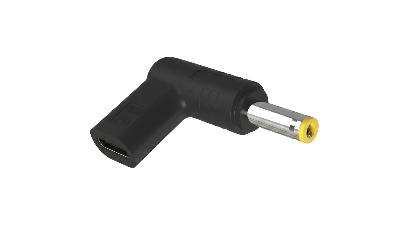 Černá pravoúhlá redukce Aligator s portem USB-C a kulatým konektorem se žlutou špičkou.