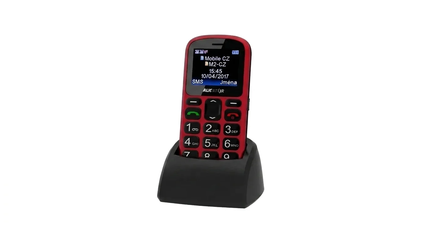 Červeno-černý mobilní telefon ALIGATOR A321 Senior s velkými tlačítky, usazený v černém nabíjecím stojánku.