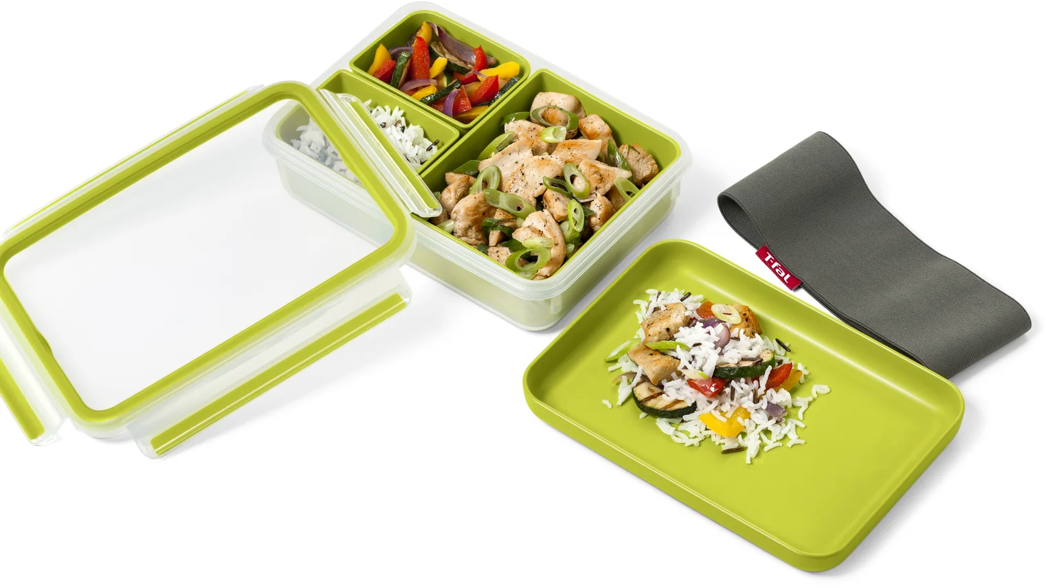 Otevřený box na potraviny Tefal Masterseal To Go se třemi miskami s jídlem, průhledným víkem, zeleným talířkem a elastickým páskem.