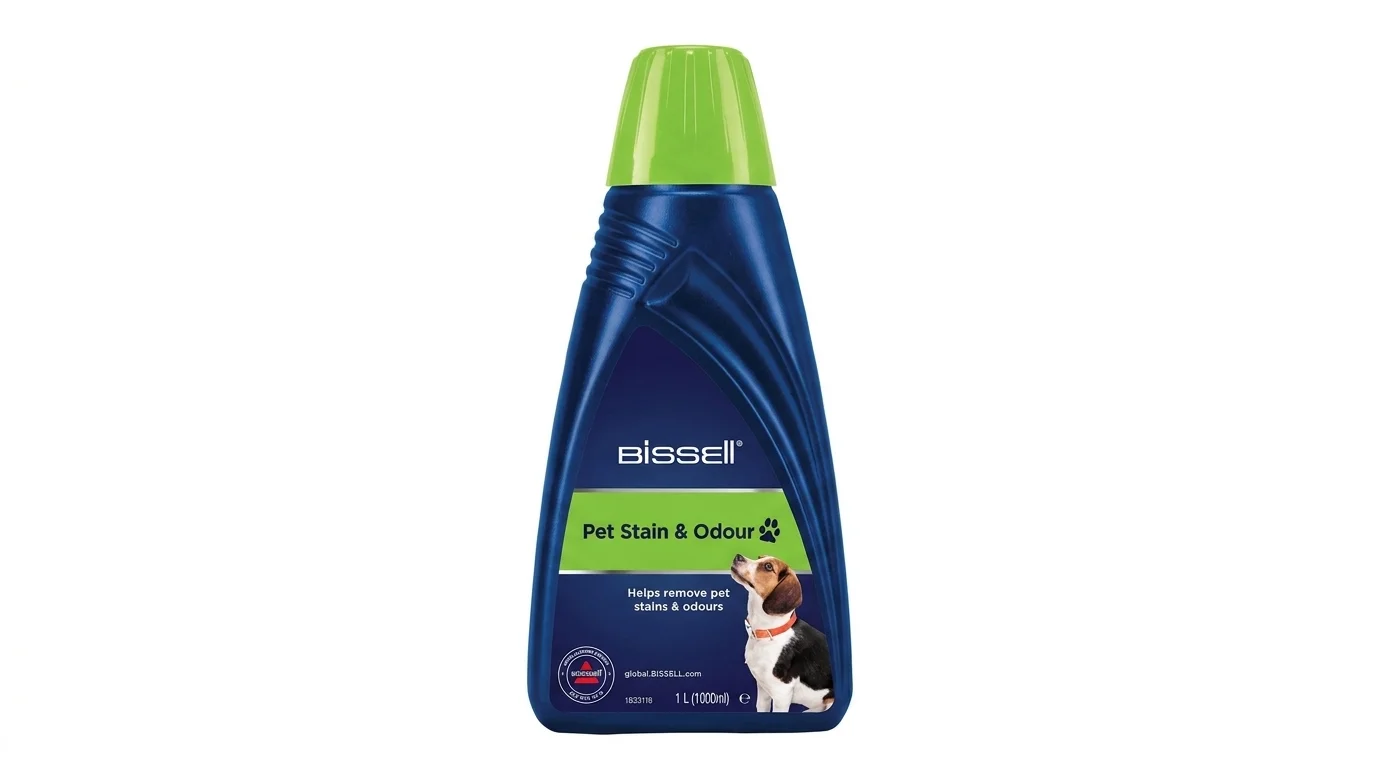 Modrá láhev čisticího přípravku Bissell Pet Stain & Odour o objemu 1 l se zeleným uzávěrem a obrázkem psa.