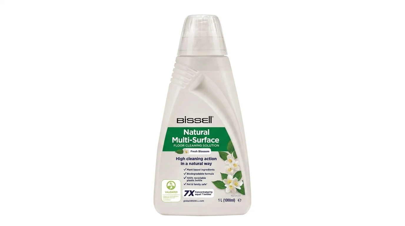 Bílá láhev čisticího přípravku BISSELL Natural Multi-Surface o objemu 1 litr s motivem bílých květů.