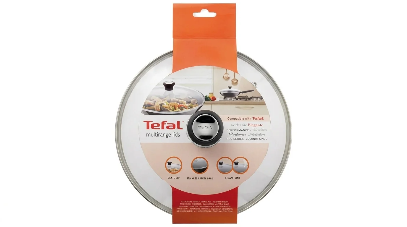 Skleněná poklice Tefal s nerezovým okrajem a středovým úchytem v prodejním kartonovém obalu.