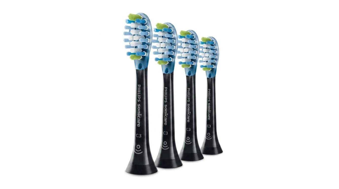 Štyri čierne náhradné hlavice Philips Sonicare C3 s modrými a zelenými štetinami na bielom pozadí.