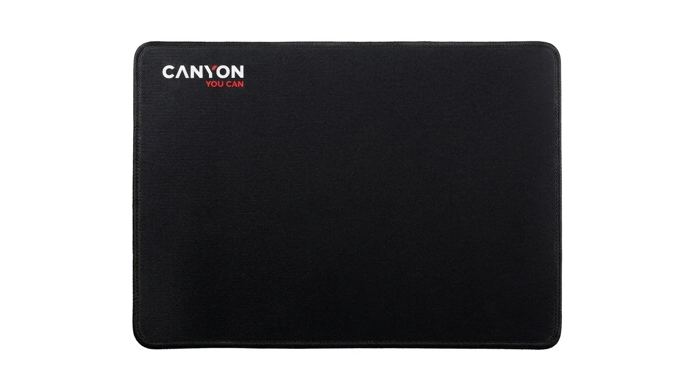 Černá podložka pod myš Canyon MP-4 s obšitými okraji a logem značky v levém horním rohu.