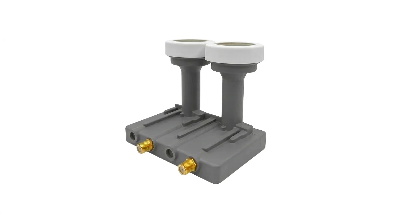 Šedý LNB konvertor TESLA Excelent Monoblok Twin se dvěma bílými hlavicemi a dvěma pozlacenými F konektory.