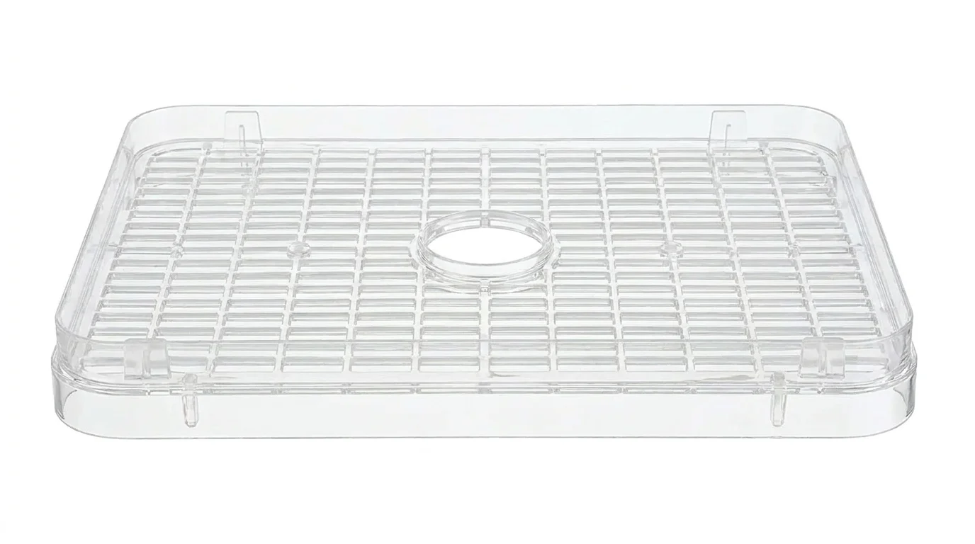 Čiré plastové sušicí plato Sencor SFX 95 s mřížkovaným dnem a středovým otvorem.