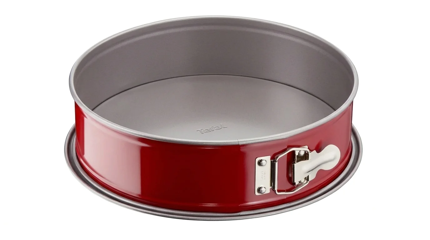 Červená rozkládací dortová forma Tefal Delibake s šedým vnitřkem, kovovou sponou a rozšířeným dnem.